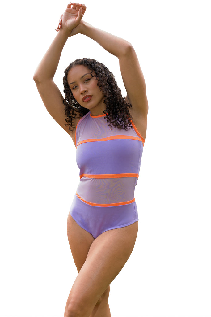 model posing arms up wearing tie back lilac and orange swimsuit